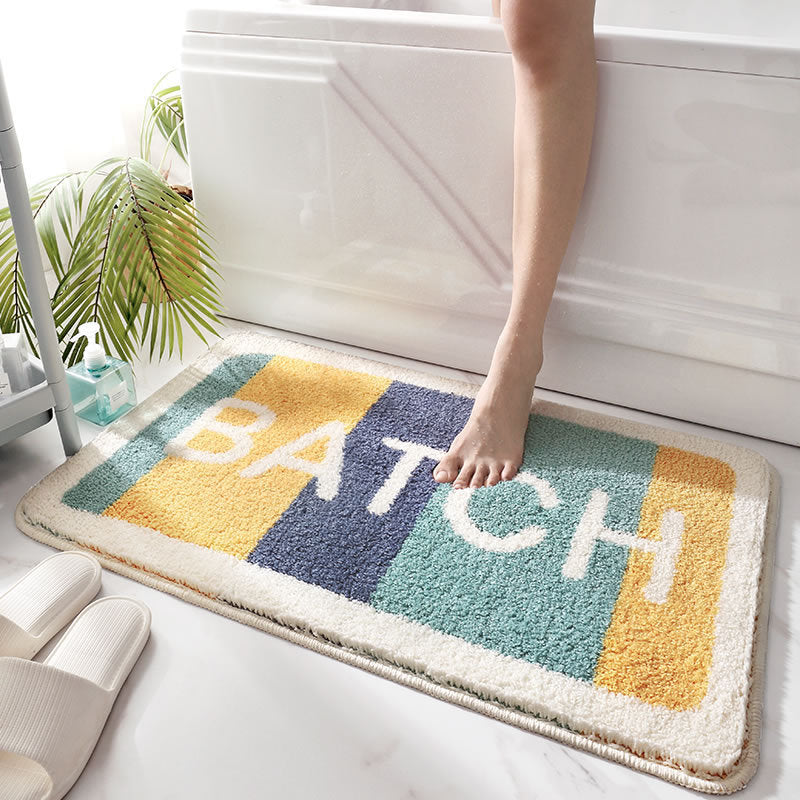 Absorbent bath mat shown at full 70x36cm size on a bathroom floor beside a scale reference