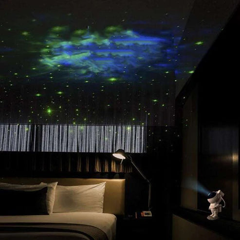 Astronaut galaxy projector lamp showing purple starry ceiling effect