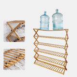 Bamboo plant stand used in garden setting with potted plants