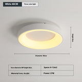 Acrylic shade being attached to the iron base during bedroom ceiling lamp installation