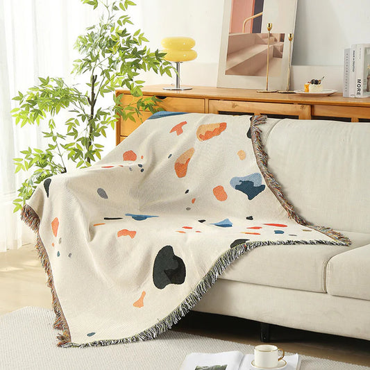 Boho fringe throw blanket abstract paint splash pattern close up