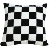 Close up of black and white checkered pattern on pillow