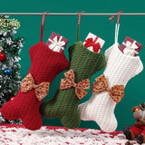 Christmas stocking with bow hanging on tree