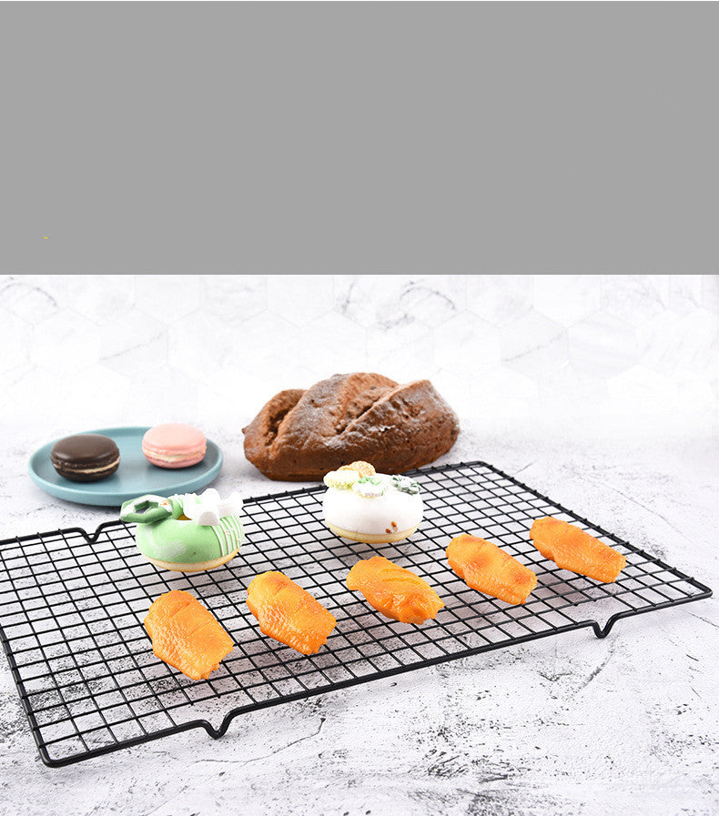 Cooling rack holding freshly baked cookies
