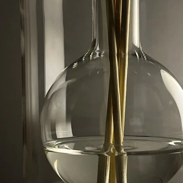 Close-up of Crystal Glass Reed Diffuser Bottle with Wooden Fragrance Sticks
