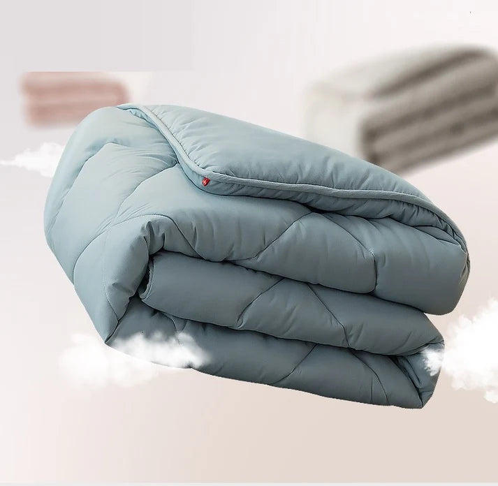 Down alternative quilted duvet insert folded in blue