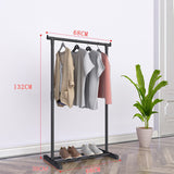 Floor drying rack styled with plant in living space