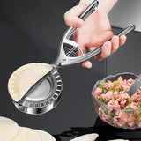 Compact stainless steel dumpling press showing hinged design