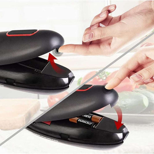 Electric can opener being used on tin can in kitchen