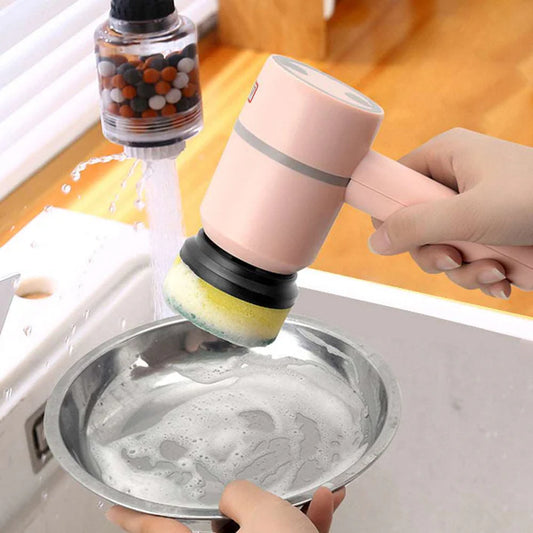 Hand using electric cleaning brush scrubber on kitchen surface