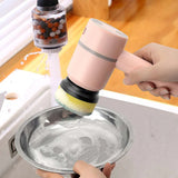 Hand using electric cleaning brush scrubber on kitchen surface