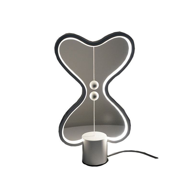 Embedded light strip casting a soft warm glow inside the oval frame structure