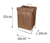 Soft sided foldable laundry hamper compressed slightly into a tight bathroom corner without scratching