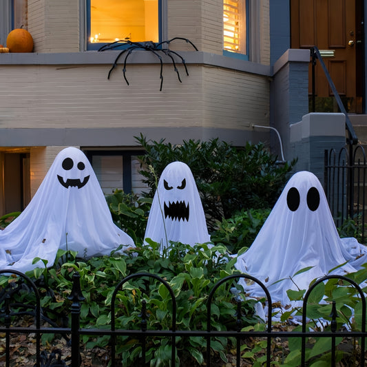 White cloth ghost Halloween decoration outdoor garden daytime display