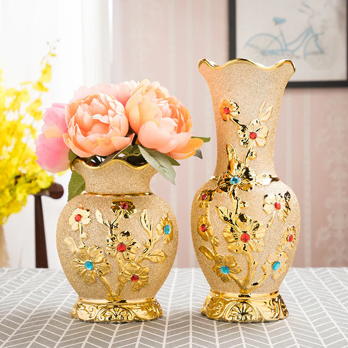 Gold ceramic flower vase with floral arrangement living room decor