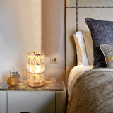 Gold crystal table lamp in bedroom setting
