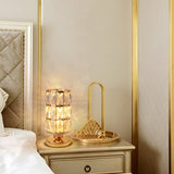 Warm glow closeup of gold crystal table lamp