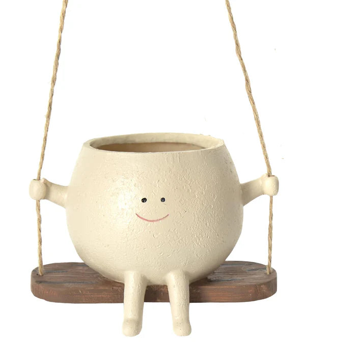 Empty hanging face planter with swing rope design