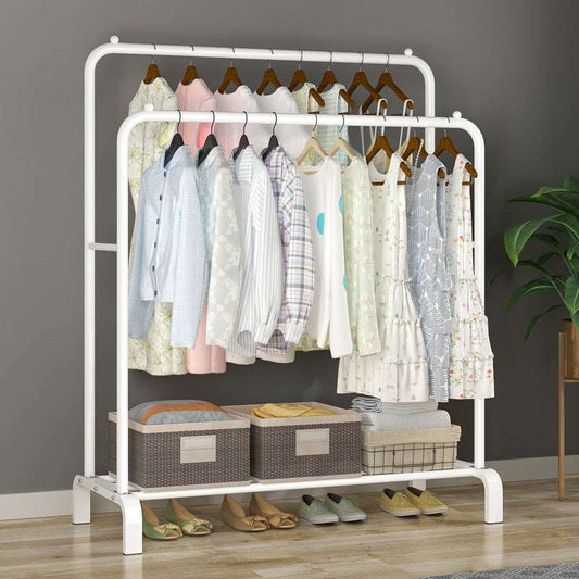 White indoor clothes drying rack in bedroom setting
