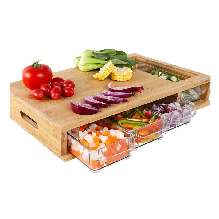 Large kitchen cutting board with drawer and fresh vegetables on bamboo surface