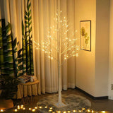 LED birch tree lights used as doorway decor