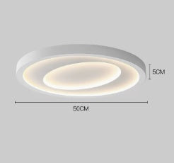 Nordic style white LED ceiling light flush on a white ceiling in a minimalist bedroom