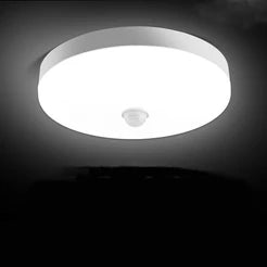 LED ceiling light glowing in dark room
