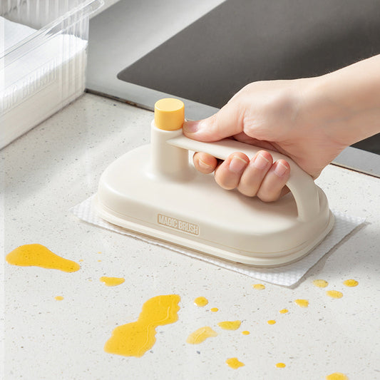 Magic brush cleaning set with sponge wipe being used on kitchen surface