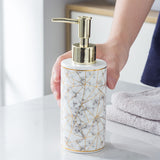 Close-up of the marble pattern and smooth glaze finish on the ceramic soap bottle surface