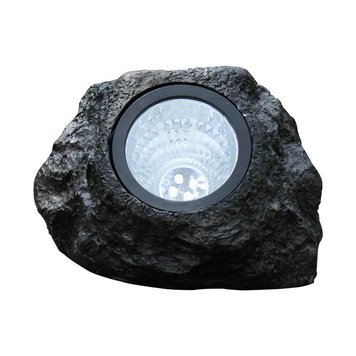 Solar simulation stone lamp placed on garden path