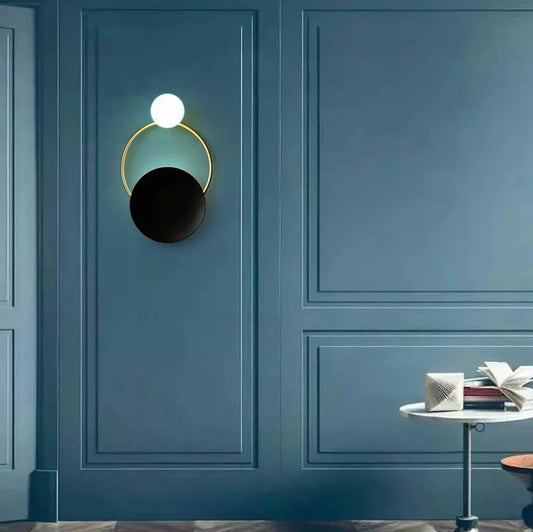 Post modern ring wall lamp warm light on blue wall hallway decor