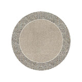 Round carpet in warm room color placed in cozy bedroom near sofa and tea table
