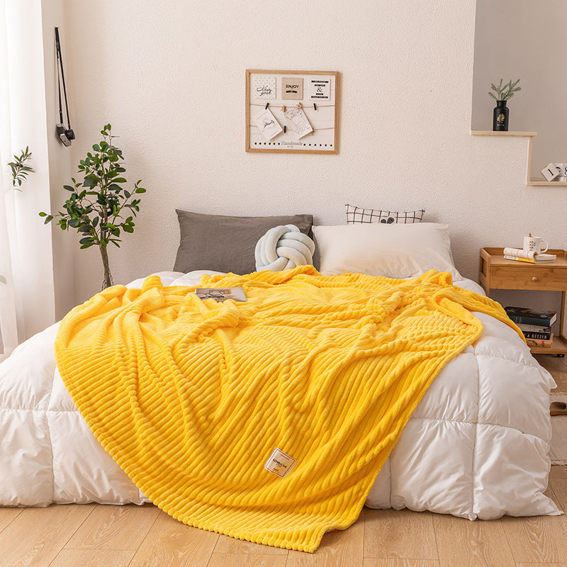 Side view of the single layer plush fleece construction of the queen size blanket