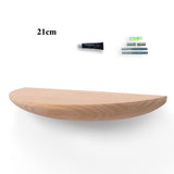 Dark reburning finish solid wood floating shelf on a living room wall