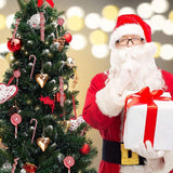 Splendas Christmas candy cane tree decoration displayed with Santa Claus figure