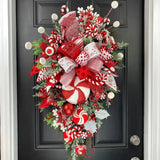 Splendas handmade Christmas wreath door pendant with candy cane decoration on front door