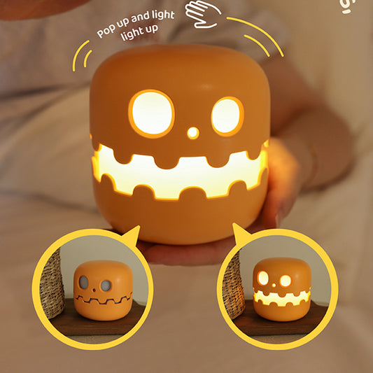 Close up detail of Splendas pumpkin lamp Halloween night light glowing face design