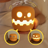 Close up detail of Splendas pumpkin lamp Halloween night light glowing face design