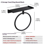Full size bath towel folded over a stainless steel wall mounted oval towel ring