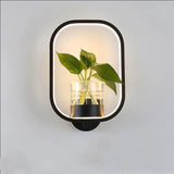Indoor stairs lighting setup featuring a white LED plant lamp on the wall