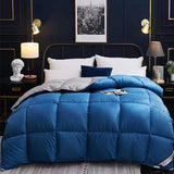 Thick quilted bed duvet in blue on bed in bedroom