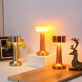 Vintage metal table lamps in rose gold bronze and space silver on desk