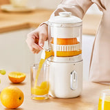 Hand pressing button on wireless portable electric juicer