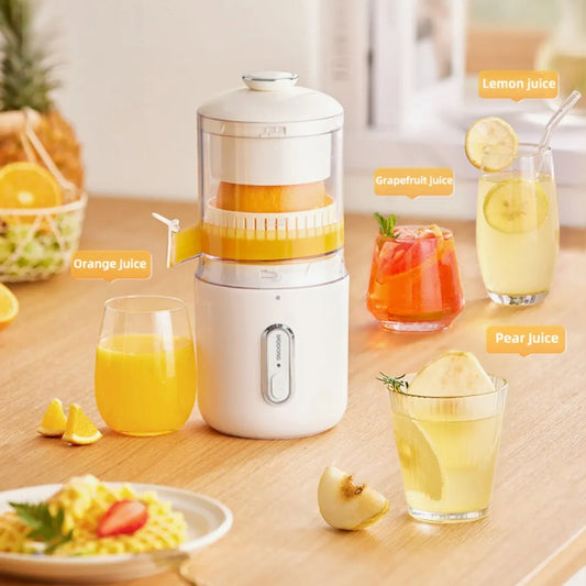 Wireless portable electric juicer with fresh citrus fruits on counter