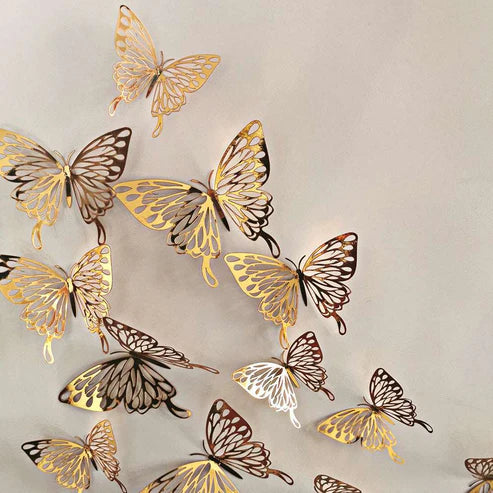 Gold 3D hollow butterfly wall stickers arranged on bedroom wall