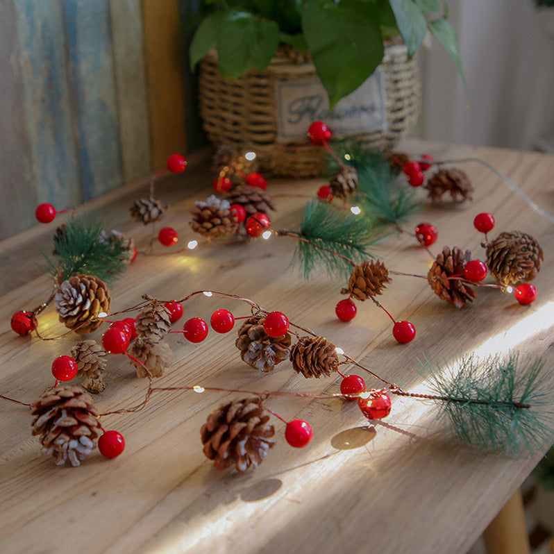 Festive pine cone and berry LED string lights for Christmas