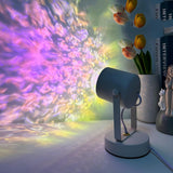 Colorful light projector on a table with flowers and books in the background