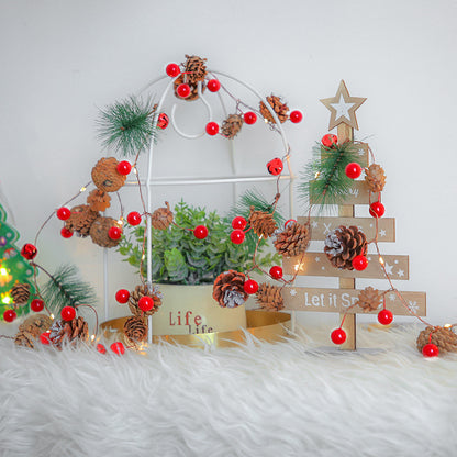 Festive pine cone and berry LED string lights for Christmas