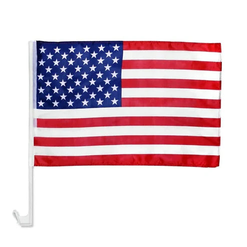 Close up of American flag attached to car side window