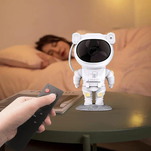 Astronaut galaxy projector lamp on desk in room setting